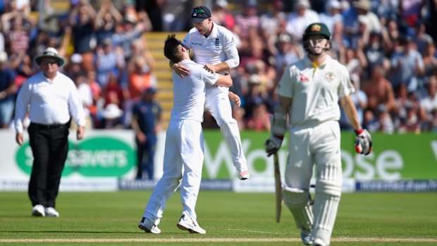 Australia batsman Chris Rogers leaves the field after being dismissed for 95 as bowler Mark Wood and Adam Lyth celebrate during day two of the Ashes Test at SWALEC Stadium in Cardiff.