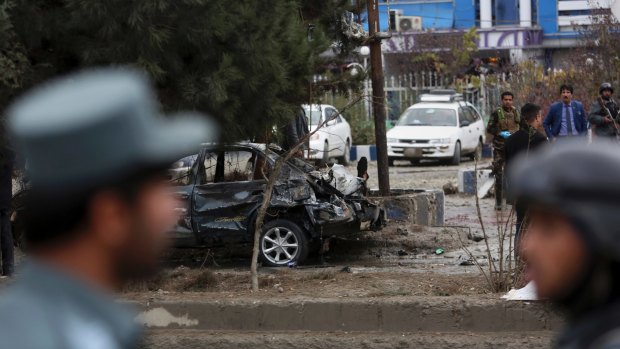 Afghan security personnel arrive at the site of the deadly suicide bombing.