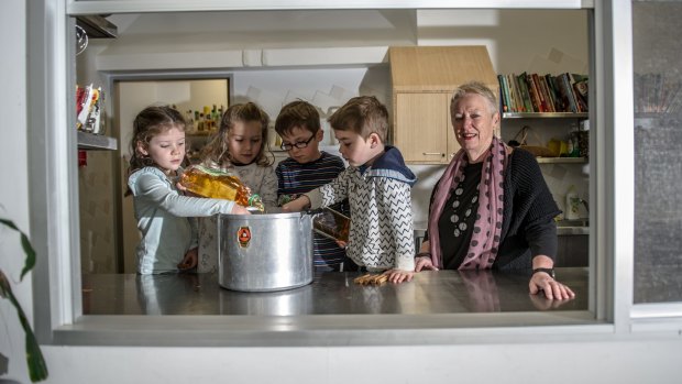 Blue Gum Community School executive director Maureen Hartung questions recent education funding changes. Pictured with (from left) Lucy Brown, Ivy Marriott, Max Morley and Nadav Aviram doing a cookery class.
