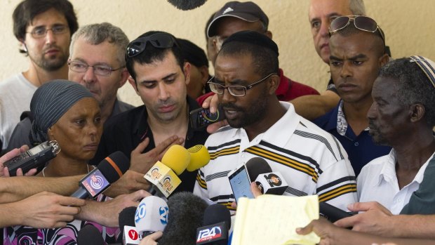 Avera Mengistu's brother Ilan speaks to the media outside the family home in the southern city of Ashkelon.