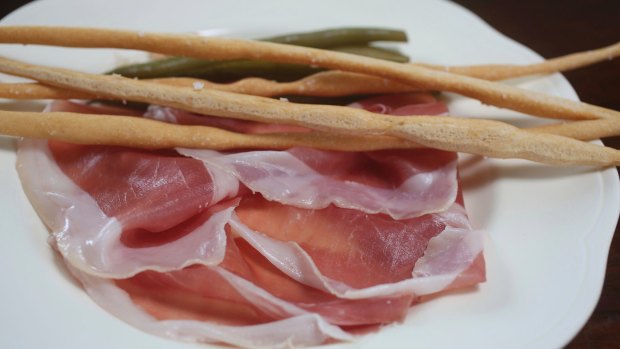 Go-to dish: prosciutto di Parma with pickled green beans and topped with long, crisp spindles of hand-rolled grissini.
