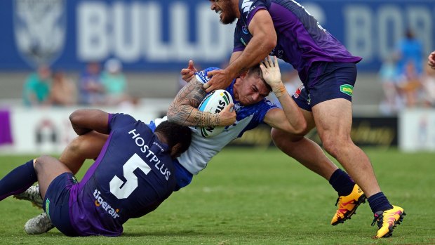 Opportunity: Brad Abbey is tackled by Marika Koroibete and Tohu Harris during the NRL trial between the Canterbury Bulldogs and the Melbourne Storm at Belmore Sports Ground.