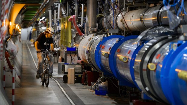 A worker on a bike inside the tunnel of the Large Hadron Collider near Geneva.