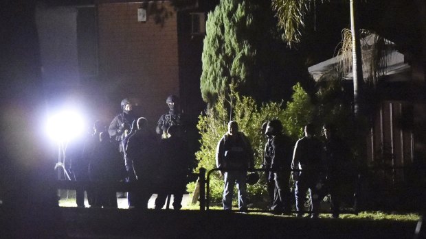 Specialist police at the scene of a stand-off in Sydney's west on Thursday night.