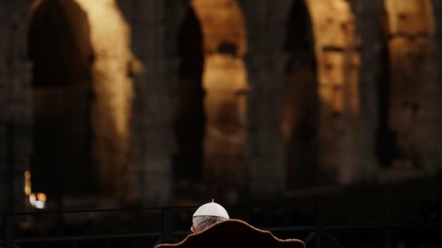 The pope in front of Rome's Colosseum.