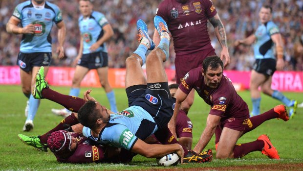 Finest hour: Jarryd Hayne touches down for a try in game one of the 2014 series, won 12-8 by NSW at Suncorp Stadium.