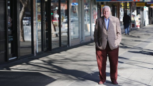 Tolarno Hotel owner Jim Fagan in a near empty Fitzroy Street on Wednesday. "It's so very bleak now," he says. "It should be the most beautiful boulevard leading to the sea." 