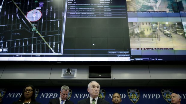New York City police commissioner Bill Bratton, centre, speaks during a news conference at police headquarters in New York.