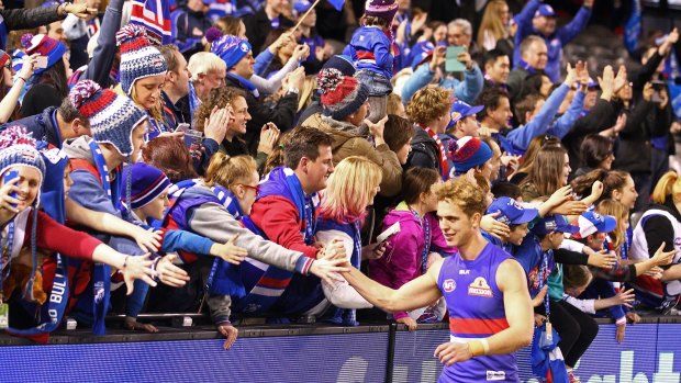 Bulldogs supporters greet Mitch Wallis after victory over Port Adelaide.