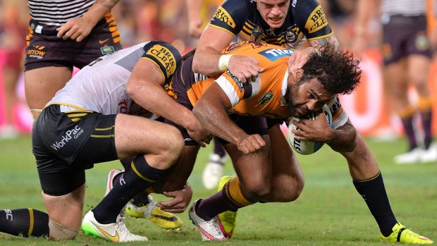 Under pressure: Broncos veteran Sam Thaiday charges into the defence during the round three NRL match against the North Queensland Cowboys at Suncorp Stadium.