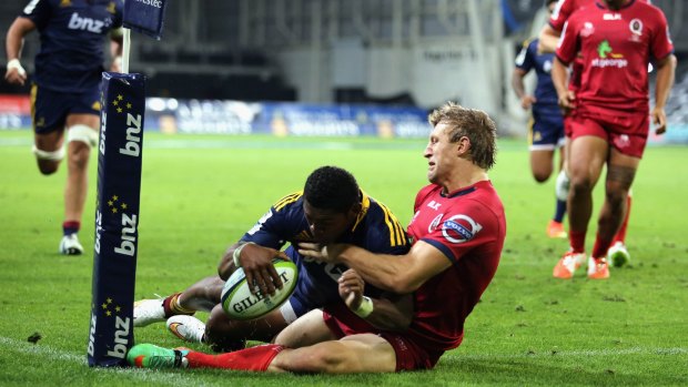 Waisake Naholo of the Highlanders touches down for a try.