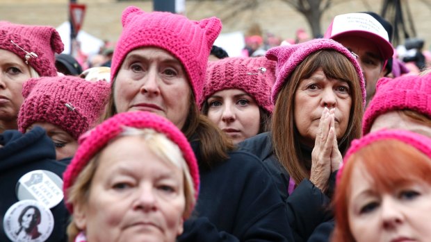 Women in "pussy hats" listen to speakers at the Women's March on Washington in January. 