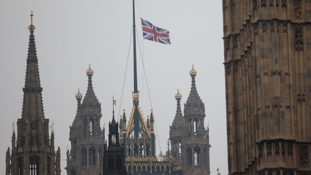 The Union Jack flag flies at half mast above the Houses of Parliament following the attack on Westminster.