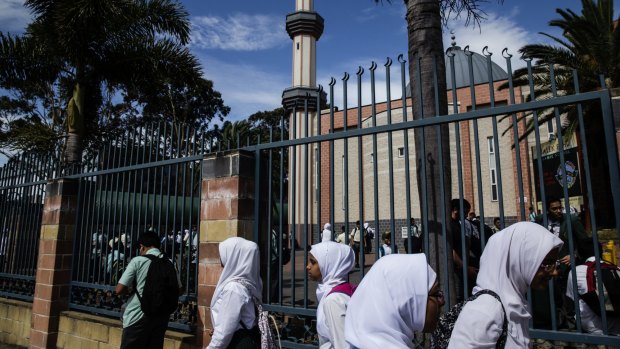 Uncertain future: Children leave the Malek Fahd Islamic School in Greenacre last week.
