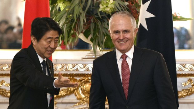 Australian Prime Minister Malcolm Turnbull, right, is welcomed by his Japanese counterpart Shinzo Abe before their meeting in Tokyo in December 2015.