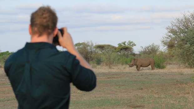 Pocock photographing a white rhino in the old country.