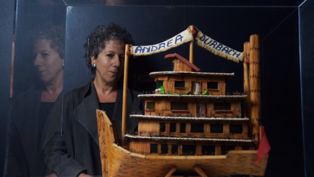 Andrea Durbach with the model boat built for her by 25 convicted murderers in South Africa.