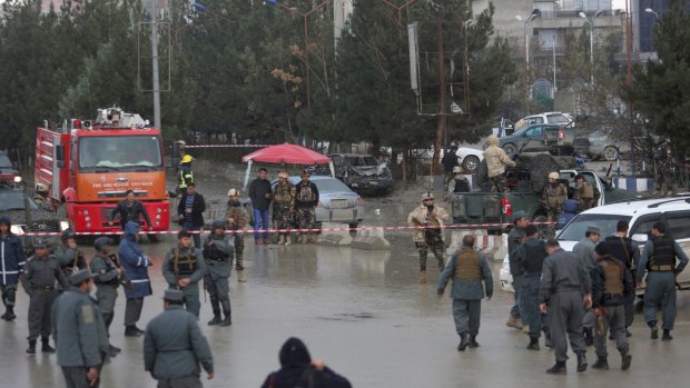 Afghan security personnel arrive at the site of the blast.