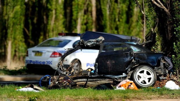 Car split in two ... Four people died in the Canberra Avenue crash.