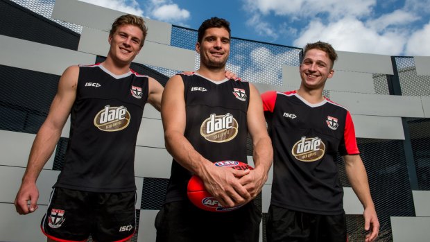 Milestone man: Leigh Montagna (centre) with Jack Newnes (left) and Jack Billings.