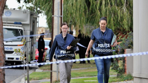 Police outside the home of Phil Walsh.