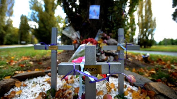 A memorial on Canberra Avenue, for Scott Oppelaar, Samantha Ford and their four-month old baby Brody Oppelaar who died in a horrific car crash on Canberra Avenue.