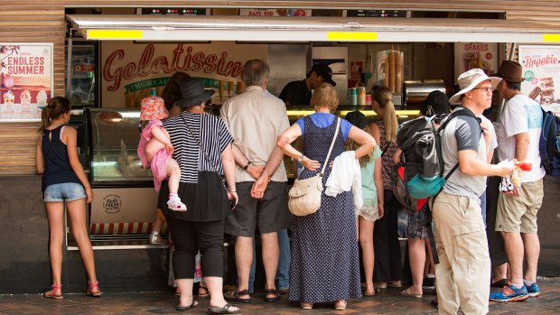 At Circular Quay, people reach for gelato, doing what they can to deal with the excessive heat. 