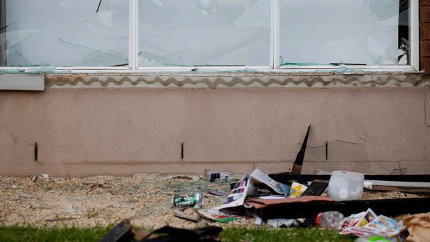 Debris and litter outside the Point Cook house. 