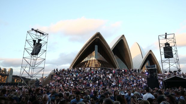 Crowded House fans wait on the Opera House forecourt ahead of the band's first of their 'Encore' tour concerts on Thursday night.