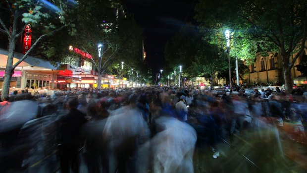 A crowd packs Swanston Street during White Night Melbourne, 2016.