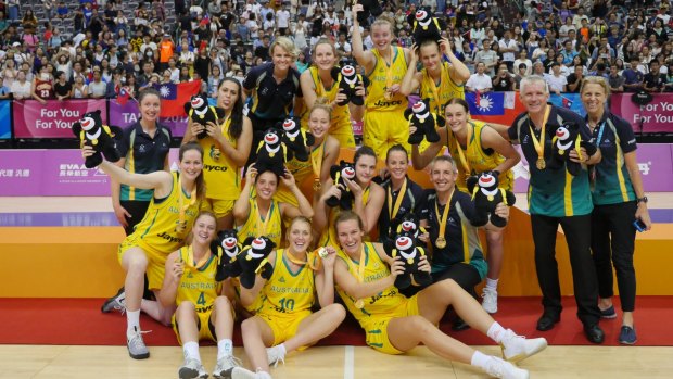 The Emerging Opals celebrate their gold medal win at the World University Games. Coach Chris Lucas is second from right.