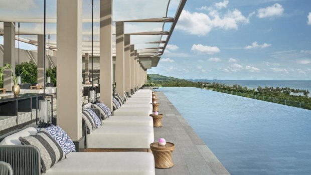 The resort's restaurant terraces tumble down first to the main pool lined with floating chairs, then further still to tranquil Long Beach.