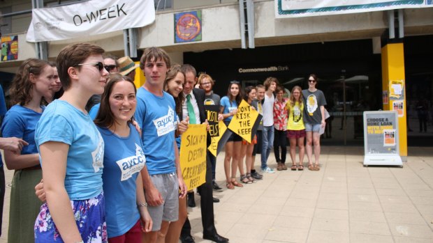 Greens MLA Shane Rattenbury and ANU students protest outside the university's Commonwealth Bank branch.