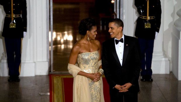 President Barack Obama and first lady Michelle Obama at their first state dinner, in honour of India. Mrs Obama wore a gown by the Indian American designer Naeem Khan.
