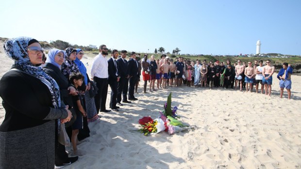 The Hammad family, with their supporters, hold a vigil for Victorian man Shaun Oliver, who died trying to save four of their children. Palestinian-Australian author Arwa Abousamra, Hazem El Masri's wife, is on the left.