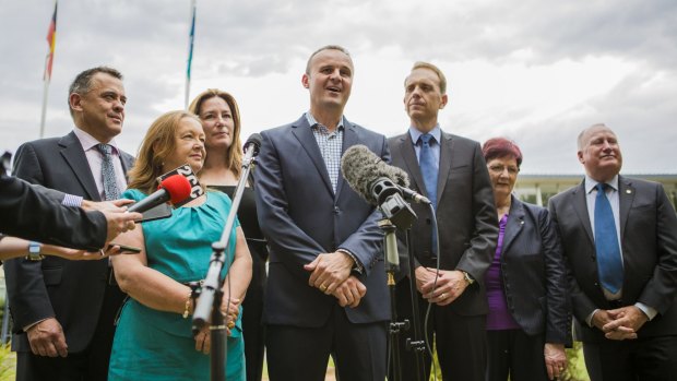 In power: ACT chief minister Andrew Barr, centre, with his party’s  MLAs,  from left, Chris Bourke, Joy Burch, Yvette Berry,  deputy leader Simon Corbell, Mary Porter, and Mick Gentleman. 