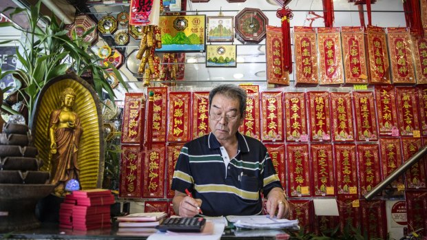 Despite Year of the Monkey celebrations it is stocktake business as usual at Leung Wai Kee Buddhist Craft and Joss Stick Trading Co, where Chinese calligraphy is just one of the gems being touted during festivities.