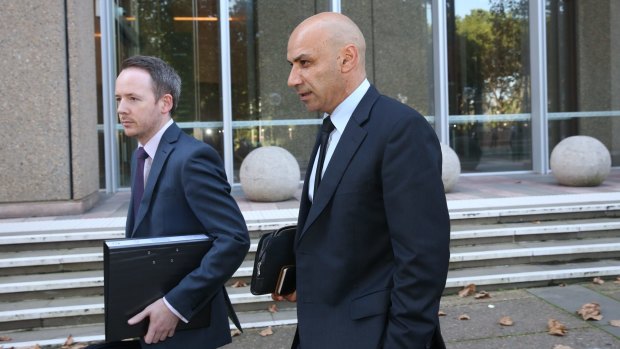 Moses Obeid, right, leaves the Federal Court on Tuesday.