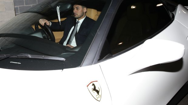 Auburn deputy mayor Salim Mehajer leaves an Auburn council meeting in his white Ferrari. 