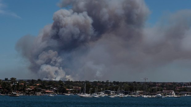 Smoke visible from Captain Cooks Bridge, rising off an out-of-control bushfire burning in the Royal National Park. 