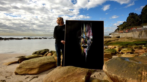 Artist Matthew Gillett with a commissioned work at Bronte Beach.
