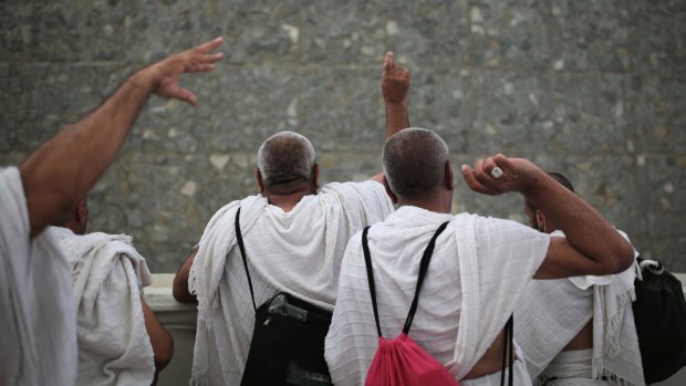 Muslim pilgrims cast stones at a pillar symbolising Satan at Mina on Thursday.