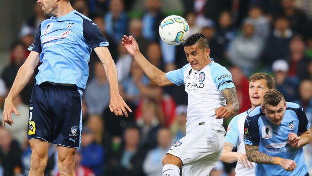 Match winner: Tim Cahill heads the ball in for a goal against Sydney FC in the FFA Cup final. 