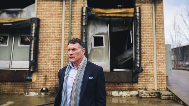 Rowan Brennan, owner of the Pialligo Estate Smoke House, surveys the fire damage.