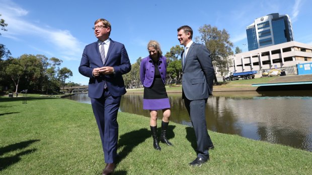 NSW Premier Mike Baird (right), Arts Minister Troy Grant and Powerhouse director Dolla Merrillees opposite the proposed new site of the museum on the Parramatta River.