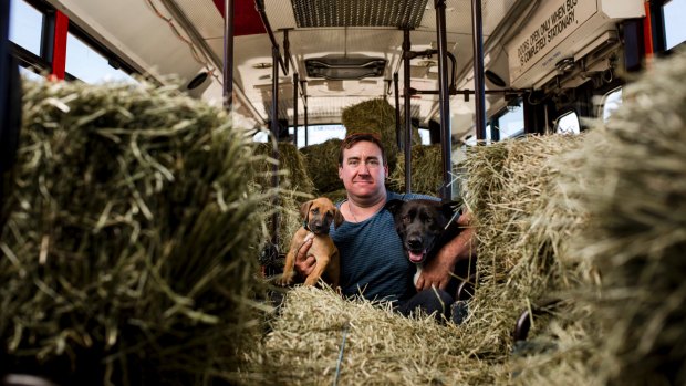 Peter Duffy is using his pink party bus to transport hay and feed to farmers in need. 