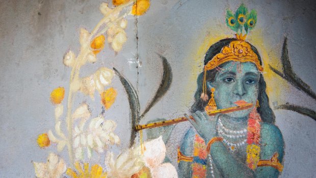 Krishna, the shepherd boy, on a painted front door in Mattancherry Palace.