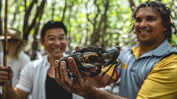 Juan Walker (right) from Walkabout Adventures with the now-famous mud crab.