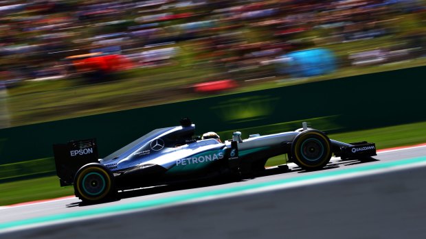 In a blur: Lewis Hamilton during qualifying for the Spanish Formula One Grand Prix.