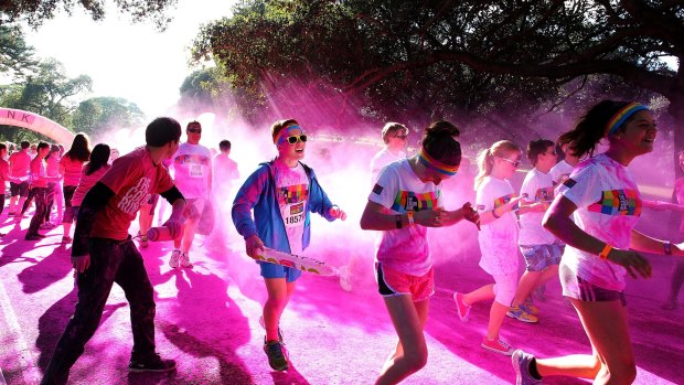 Running amok: About 22,000 people took part in the Color Run at Centennial Park on Sunday.